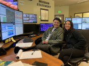 Image of two dispatchers at the console