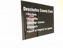 Sign displaying Clerk's Office services