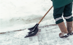 Shoveling snow off sidewalk