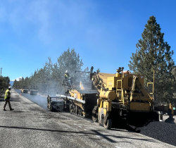 Asphalt truck & Pavement rollers installing pavement on Tumalo Reservoir Rd. 