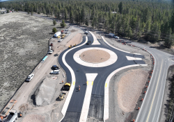 Aerial view of a new roundabout under construction at S Century Drive and Huntington Road.