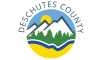 Deschutes County logo with mountains, trees, river and sun